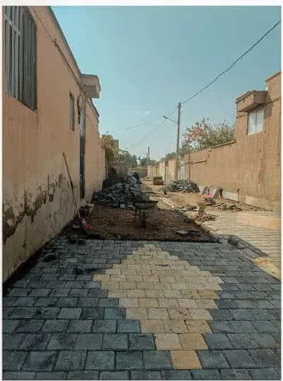 📷گزارش تصویری|  عملیات‌نصب جدول کانیووسط ونصب تایل بتنی کوچه نیازمند ۱۹